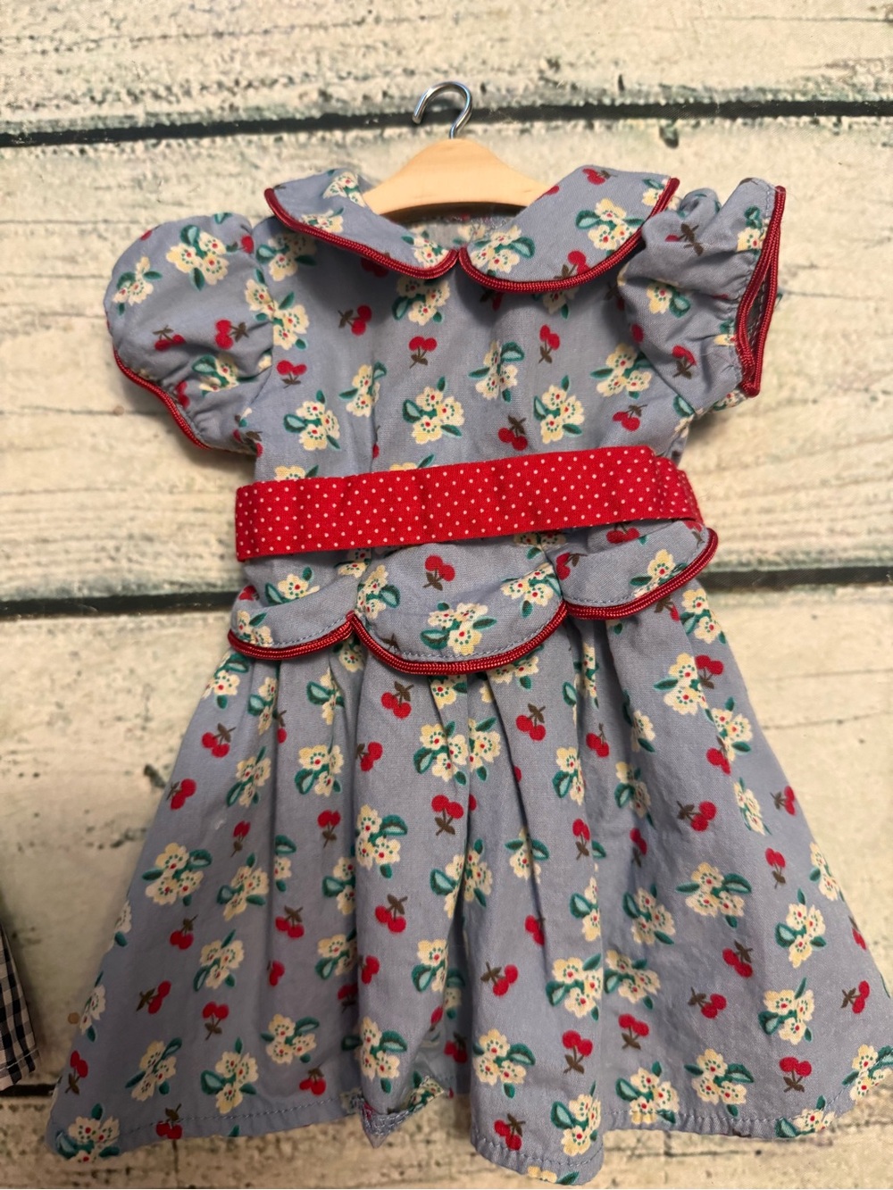 2 American girl doll dresses and 10 wood doll hangers. - Picture 2 of 10